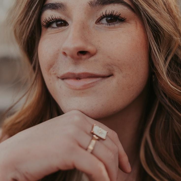 A. Chen, Lead Design Curator at Gentle Pathway Top, reviewing corporate floral arrangements